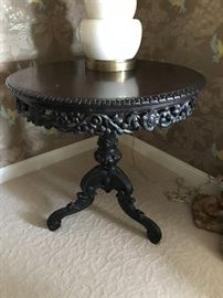 Carved ebonized antique pedestal table