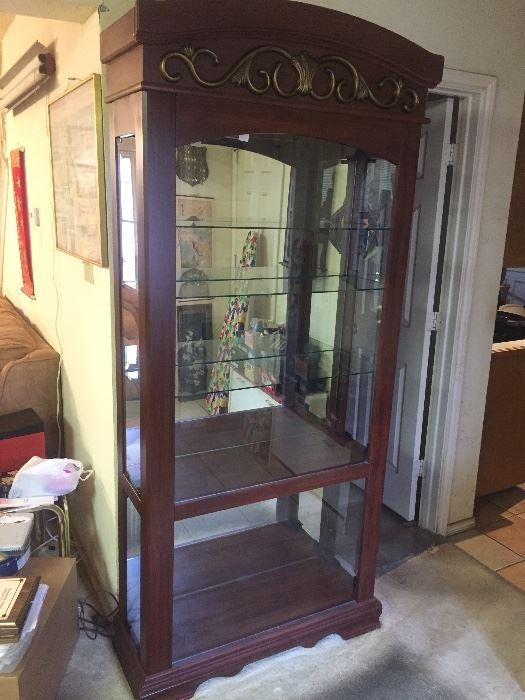 Beautiful Curio Cabinet.
Mirrored back and lighted.
Glass shelves.
81" Tall 35" Wide 14" deep
