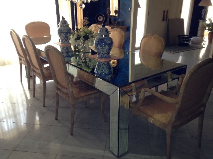 10' mirrored dining table with 6 carved wood and upholstered side chairs and 2 matching arm chairs