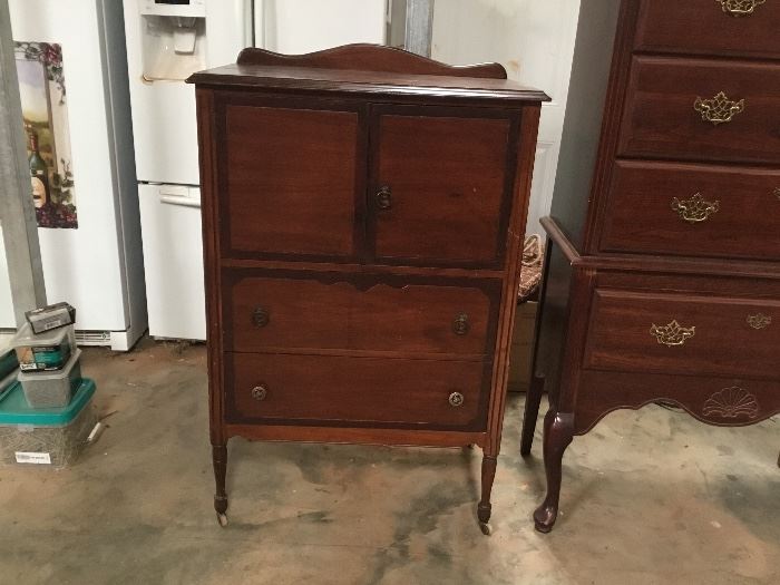 Antique Cabinet. There are 2 slide outs inside the doors & the drawer pulls on the bottom drawer are not original