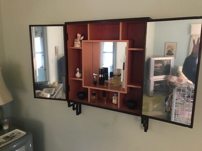 Mirrored interior of hanging cabinet