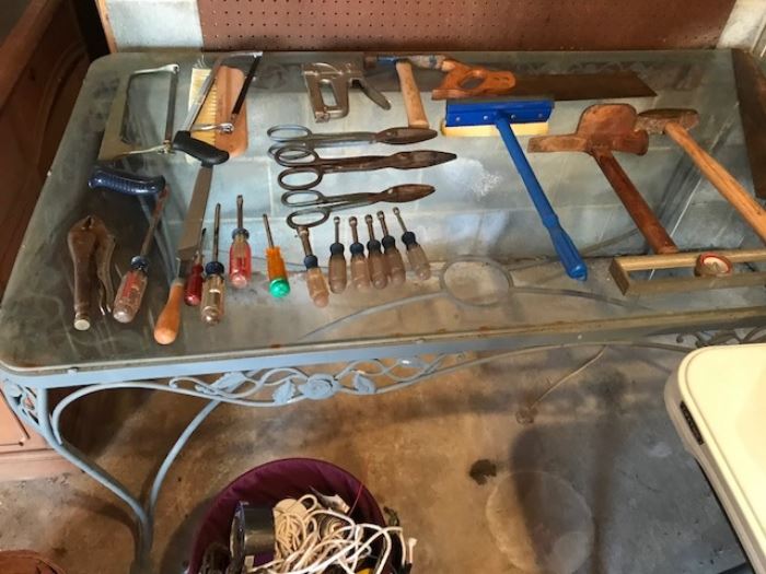 More tools on a glass top wrought iron patio table