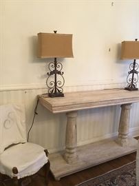 Long white washed console / two iron lamps with burlap shades