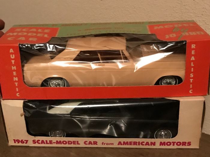 Toy model cars with their packaging. 