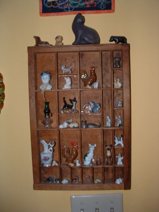 Neat shelf of animal collectibles