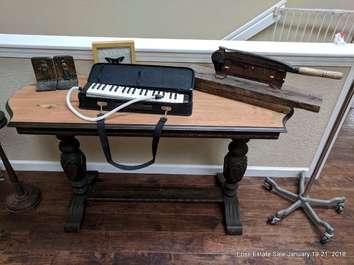 Mahogany hall table,  tobacco cutter and pilgrim bronze bookends and the elusive mouth-powered piano demonstrated here: 
 https://www.youtube.com/watch?v=BKkPFlqklh4 