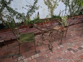 Patinated steel patio table