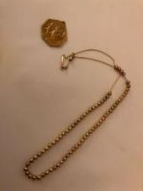 gold pendant and necklace