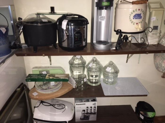 various kitchen appliances with glass containers and other kitchen itmes