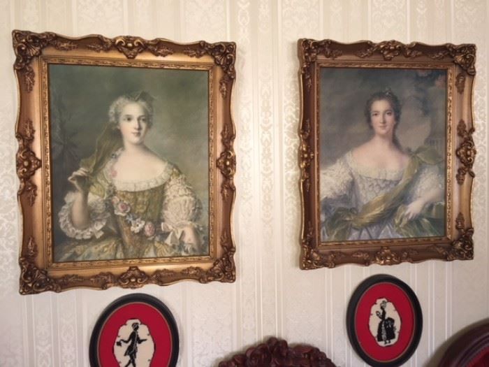 pair of beautiful lady portrait in gold guild frames and pair of cross stitch work in oval frames over sofa