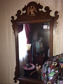 nice walnut framed mirror with Eagle design on top of mirror