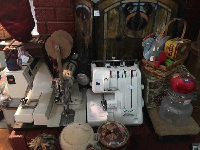 assortment of sewing items and sewing machines
