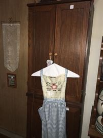 beautiful kitchen pantry cupboard and ladies apron