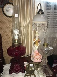 red and white glass oil lamps with ink well and other items