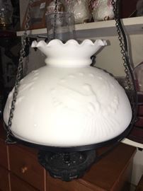 one of two hanging cast iron matching swinging oil lamps/ converted to electric- American Eagle on globe