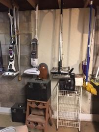 various cleaning tools and step stools and storage units