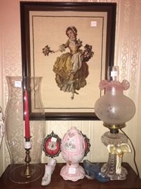 Hurricane lamp , porcelain egg, shoes, oil lamp, and cross stitch picture