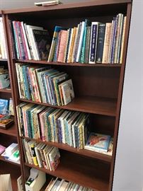 Lots of childrens books and 4 Bush bookcases