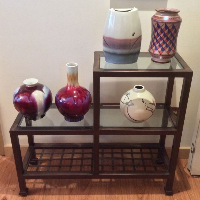 Stair step metal & glass shelf from Del-Teet, studio pottery including Italian Vignoli Faenza vase (top right) & Gerald Newcomb vase (lower right). 