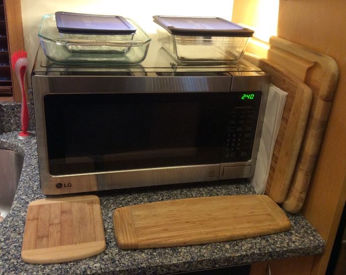 Newer LG stainless & black 1000W microwave (Model LCS1112ST - manufactured May 2017), Pyrex baking pans, wooden cutting boards