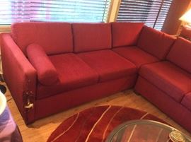 Rusty red L-shaped sectional sofa - with cat claw damage at both ends