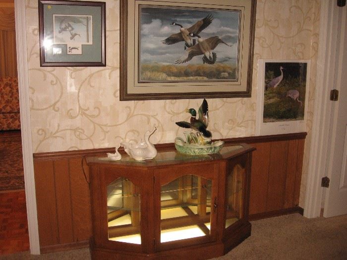 Lighted curio cabinet, Ray Harm prints, Hull pottery ducks