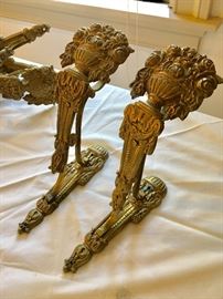 Several pairs of ornate curtain rods