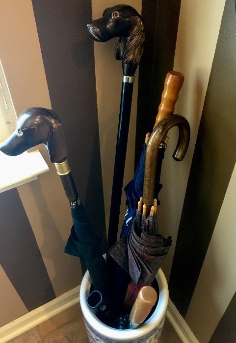 Carved cane, umbrellas 
