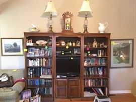 three piece entertainment center wall units, books, DVDs, framed prints, Sony flat screen tv