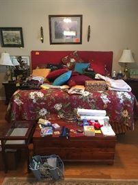 king size bed with upholstered headboard and Sealy mattress and all bedding, cedar chest, curio table, decorative pillows, lamps, mirrors