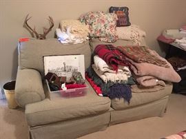 oversized loveseat, blankets, antlers, prints