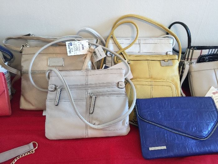 We have over 100 new purses!  Brands include:  Nine West, Tommy Hilfiger, Stone Mountain, Izod,  & Tignanello