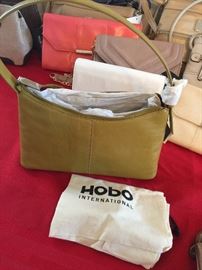 We have over 100 new purses! Brands include: Nine West, Tommy Hilfiger, Stone Mountain, Izod, & Tignanello