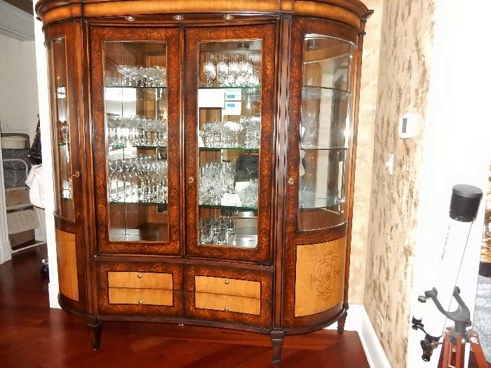 Two-toned veneered lighted display cabinet, curved sides a one of a kind unique stunning piece.
