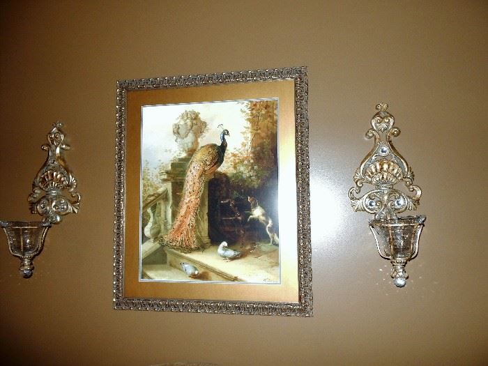 Wall sconces with glass inserts and framed Peacock artwork
