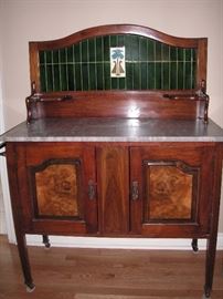 Antique wash stand with tile back and marble top; burl wood door panels