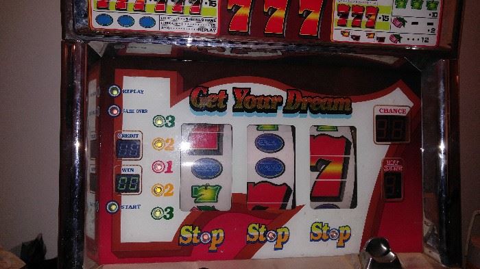 Big action Triple 7 slot machine works great takes tokens