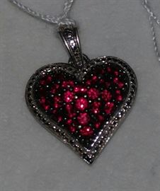 Standing silver heart pendant with handset  gemstones 