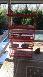 Very large red heavy cast-iron display rack with coating