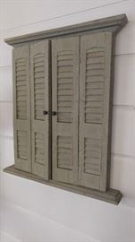 Framed mirror with shutters