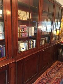 Gorgeous antique English library bookcase that is over 12 feet in length.  This cabinet breaks down into seven parts for easy moving.
