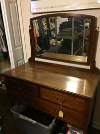 First bedroom:  a lovely antique English gentleman's chest of drawers with mirror