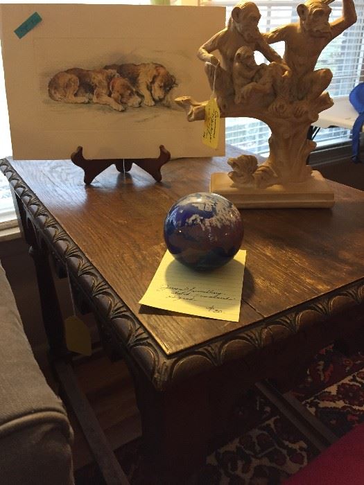 Note the side table's carving.  James Lundberg Studios glass paperweight of the world, signed and numbered.