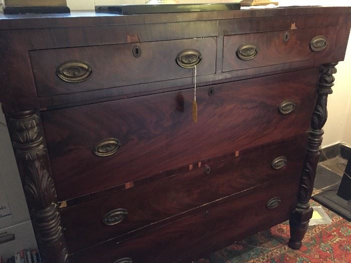 Gentleman's mahogany chest of drawers with wonderful wood carving details.