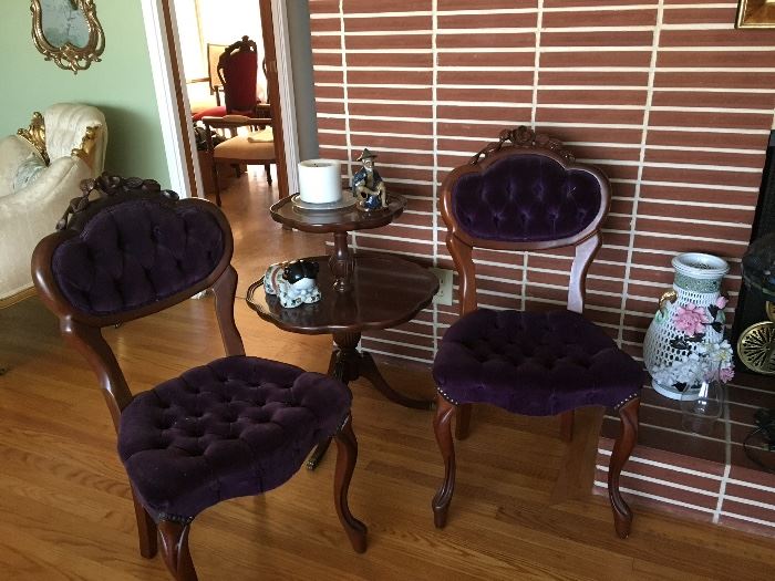 A pair of velvet accent chairs. 