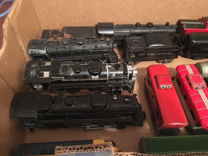 We have several boxes of model train engines and cars.