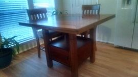 Storage in base of dining table