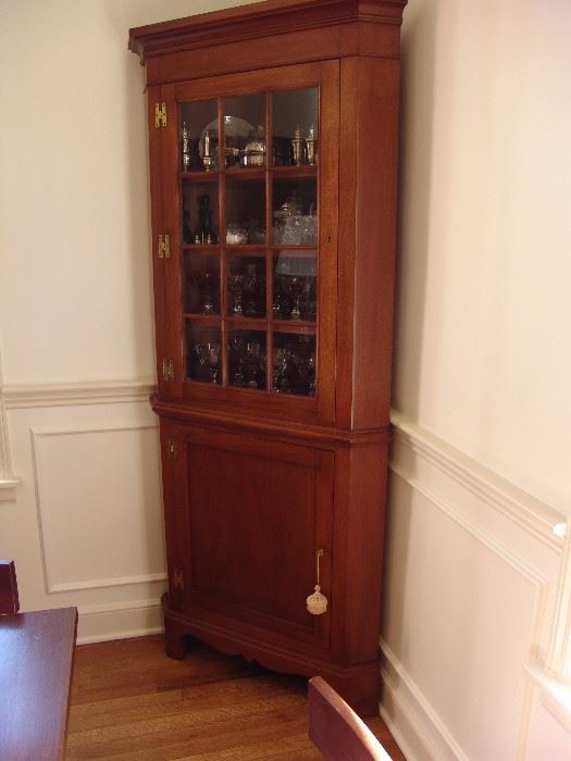 Second mahogany corner cabinet with glass door and shelves