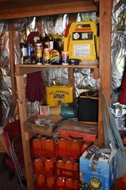 Garage Shelving containing various items including a 2 in 1 Jump Start/Air Compressor, good Cleaning Supplies, Fishing Tackle, lots of hooks of various sizes and the Orange Canister Floating Line and More! 