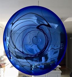 This cobalt art-glass piece could be used for serving or hung for display as shown.